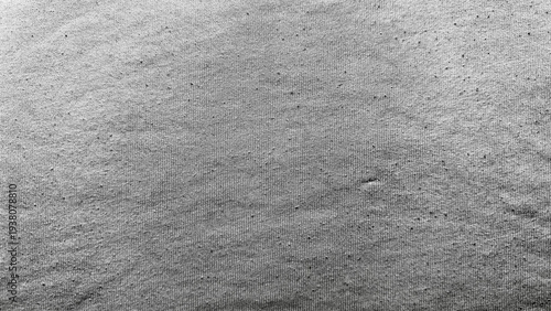 speckled gray abstract texture reveals fine grain scattered dots gentle undulation monochrome macro surface