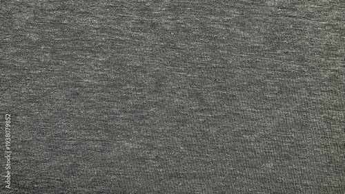 heathered gray cotton jersey knit fabric macro texture with subtle mottled flecks and soft neutral tones filling frame