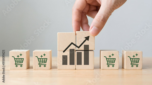 Wallpaper Mural Hand stacking blocks showing business growth and shopping cart icons symbolizing sales increase Torontodigital.ca