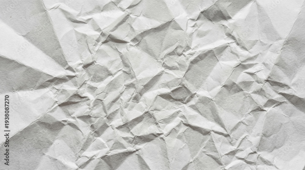 Obraz premium Abstract texture of crumpled white paper with shadows and highlights, close-up
