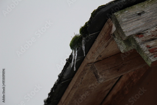 icicles on the roof of a house