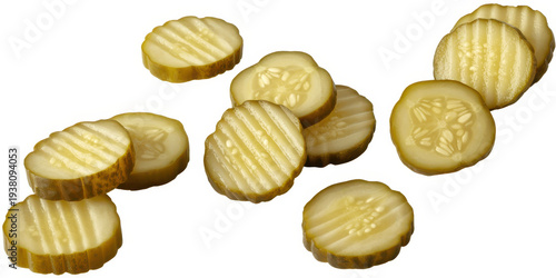 Sliced pickles with ridges on white background slices