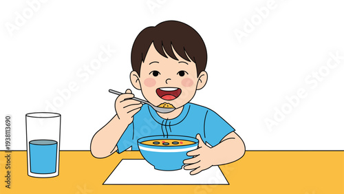 Cheerful young boy enjoying a healthy meal of hot soup at the dining table with a glass of water on clean white background.