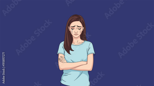 Young woman with long brown hair crosses her arms and cries with visible tears showing deep sadness, grief, or emotional distress.