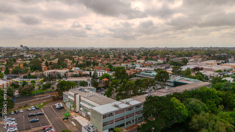 Obraz premium Panoramic Aerial Drone view of Inner Suburbs of Melbourne housing, roof tops, the streets and the parks, the roads and trees of Ascot Vale Moonee Ponds Brunswick Essendon and Maribyrnong in VIC Victor