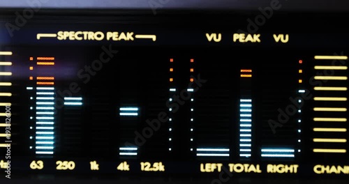 Fluctuating digital VU meters spectrum analyzer of a vintage HIFI deck. Macro close up shot, real time, no people