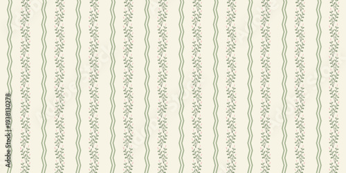 A close-up view of a beautiful wallpaper with a delicate floral pattern and wavy stripes in muted colors.
