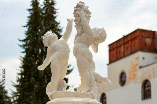 Decorative statues on the courtyard fountain of historic Dubno Castle, Rivne Region, Ukraine