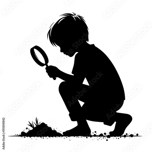 Child examining ground with magnifying glass, outdoor nature scene