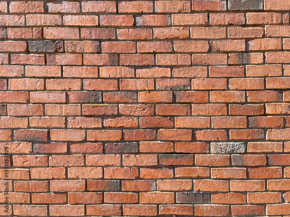 Fototapeta premium Red brick wall texture background with traditional masonry pattern.