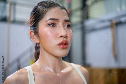 Pretty woman is exercising at a fitness center. Free Download Pretty woman is exercising at a fitness center. - GFXLoad
