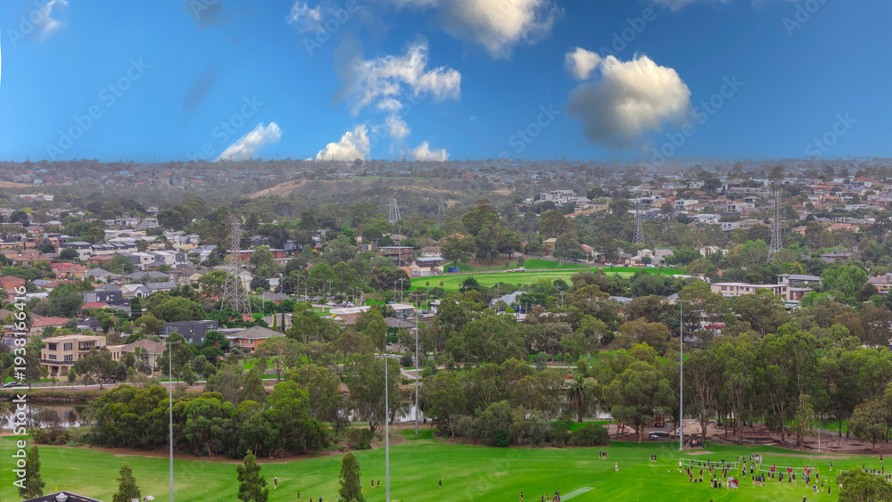 Obraz premium Panoramic Aerial Drone view of Inner Suburbs of Melbourne housing, roof tops, the streets and the parks, the roads and trees of Ascot Vale Moonee Ponds Brunswick Essendon and Maribyrnong in VIC Victor