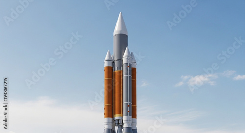 Powerful rocket standing tall against a clear blue sky ready for launch.