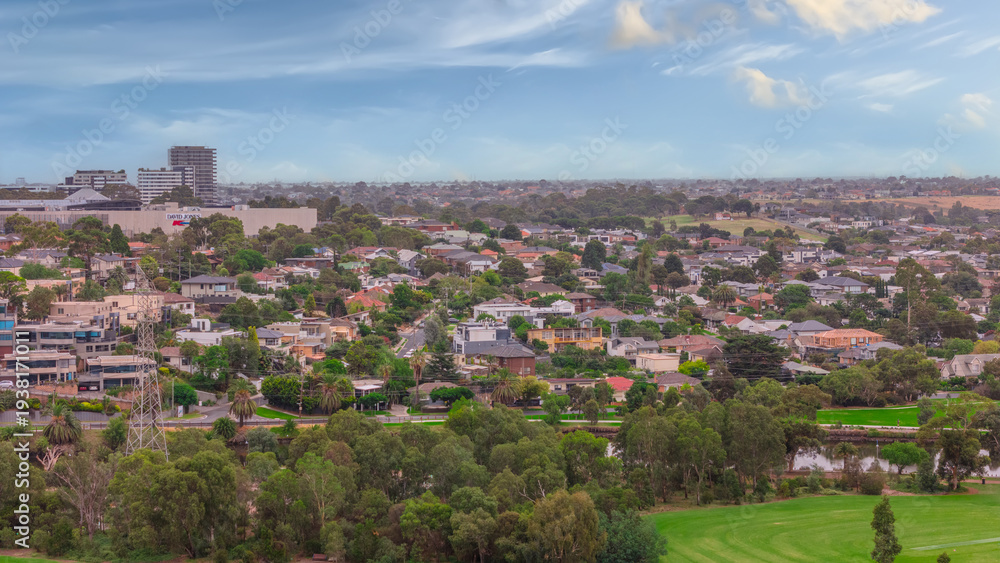 Obraz premium Panoramic Aerial Drone view of Inner Suburbs of Melbourne housing, roof tops, the streets and the parks, the roads and trees of Ascot Vale Moonee Ponds Brunswick Essendon and Maribyrnong in VIC Victor