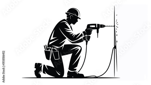 Construction worker kneeling drilling into wall with power drill wearing safety gear and tool belt industrial work scene