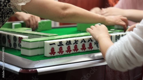 Traditional Chinese Mahjong Game Close-Up with Players