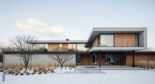 Modern house with wood and glass exterior in snow
