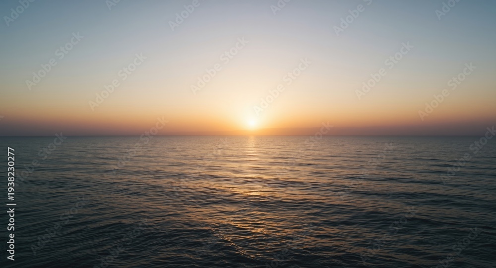 Obraz premium calm oceanfront landscape at sunset with soft glowing sky