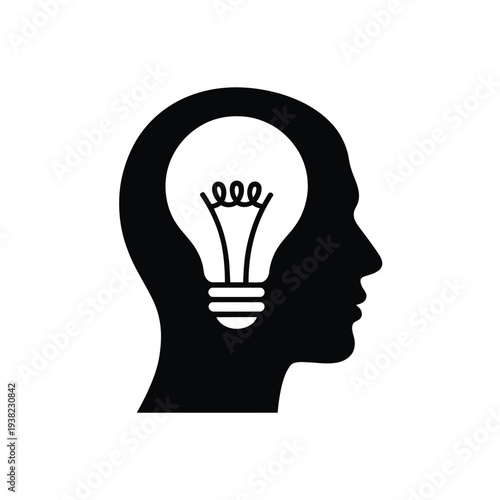 A black silhouette of a human head containing a bright lightbulb