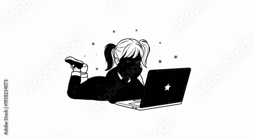 Child with pigtails lying on stomach, using laptop with star