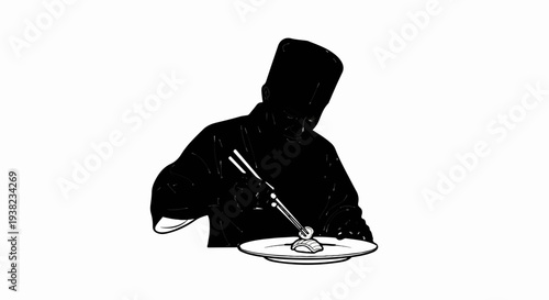 Chef skillfully arranges food on a plate with chopsticks, creating a masterpiece