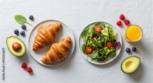 Exquisite continental breakfast assortment on a textured white surface backdrop