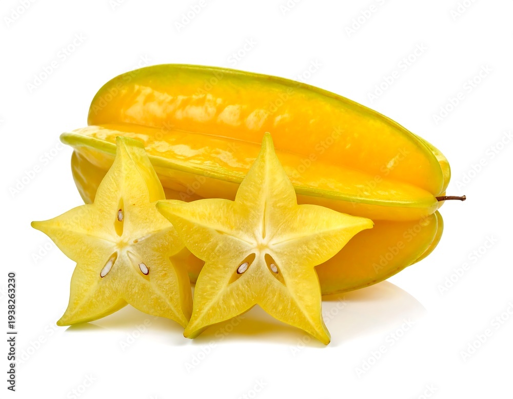 Fototapeta premium Ripe yellow star fruit, one whole and two cross-sections, isolated on white