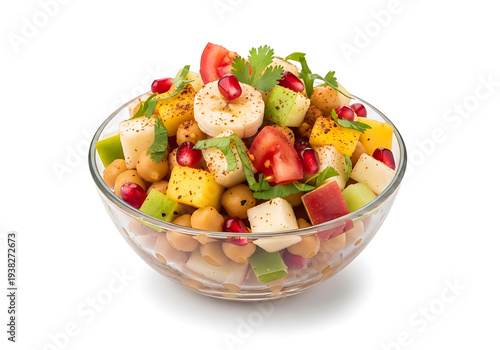 Healthy Chickpea and Mixed Fruit Chaat Salad in a Glass Bowl. Features Chickpeas, Apple, Banana, and Pomegranate with Indian Spices. A Nutritious Vegan Street Food Snack or Appetizer for Fitness Diets