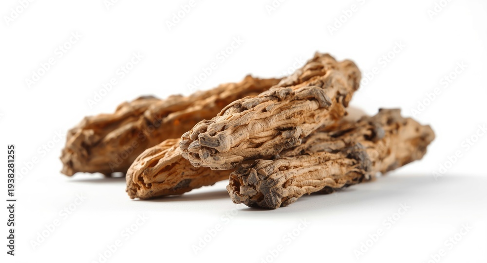 Fototapeta premium White backdrop highlighting rough textured dried liquorice roots