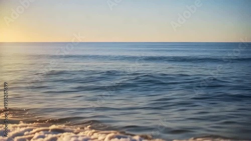 Golden sunset over calm ocean waves