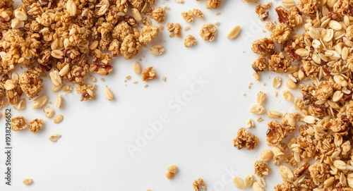 Assorted granola and muesli grains scattering on a clear white surface