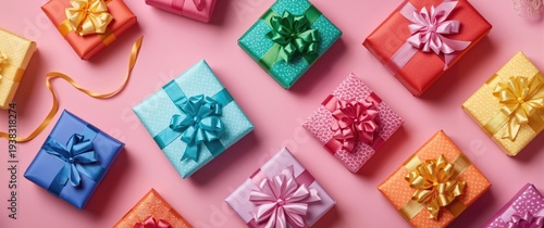 Colorful festive gift packages with neat bows on a pastel pink backdrop suitable for celebrations
