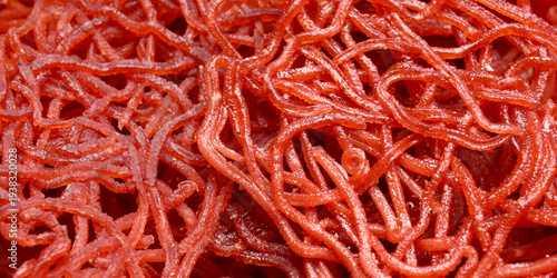 Texture details of bright red noodle snacks