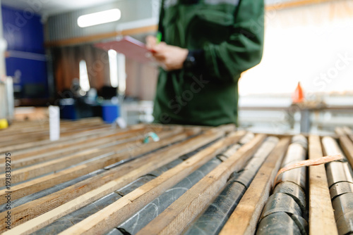 Obraz na plátně Geologist evaluating core samples in geological laboratory