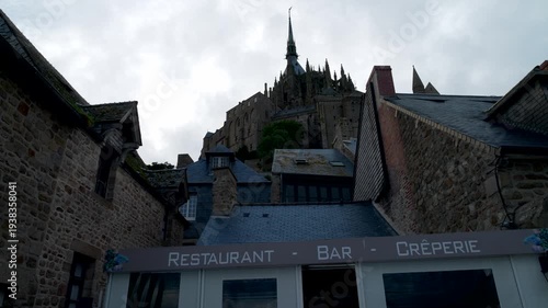 Mont-Saint-Michel, Normandy, 08-24-2024. Low view, Mont Saint Michel Abbey. Panning 4K