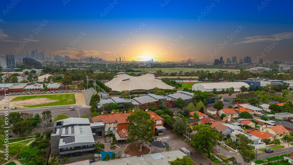 Obraz premium Panoramic Aerial Drone view of Inner Suburbs of Melbourne housing, roof tops, the streets and the parks, the roads and trees of Ascot Vale Moonee Ponds Brunswick Essendon and Maribyrnong in VIC Victor