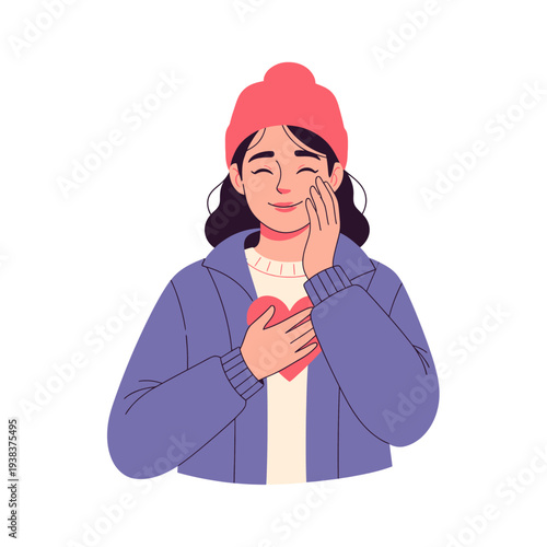 Young woman with heart on chest, hand on cheek, wearing beanie, feeling love and gratitude