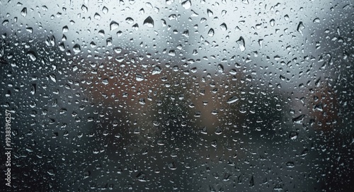 Delicate raindrops designing soothing abstract impressions on a window glass