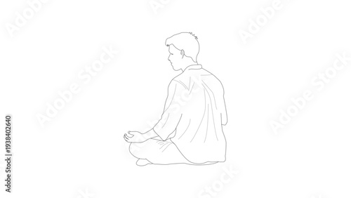 Back view of a boy praying in meditation position