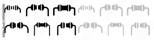 Collection of electronic resistors in black and white, showcasing different band patterns for identification.