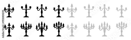 Elegant candelabra silhouettes transition from black to grey, symbolizing history and fading light.