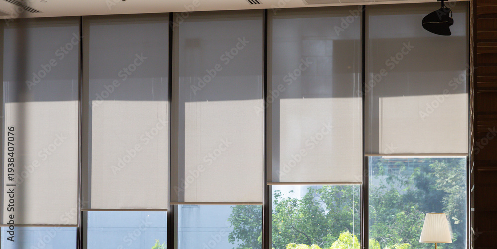 Fototapeta premium Modern roller blinds softly filter sunlight