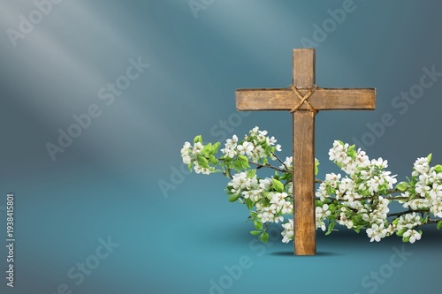 Effects sunlight on wooden cross and flowers