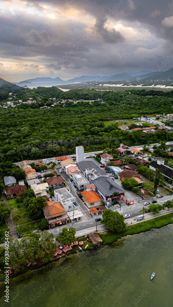 Fototapeta premium Aerial Waterfront Village Boats Restaurants Atlantic Forest Hills Lagoa Da Conceicao Florianopolis Brazil Island Coastal Scenery Santa Catarina South America Travel Destination