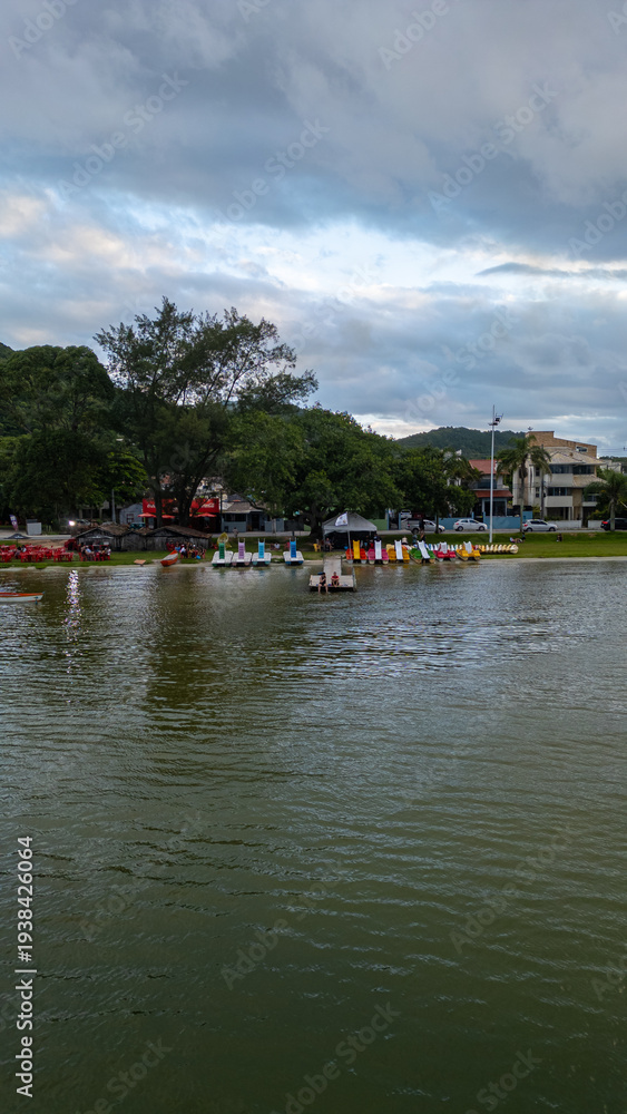 Fototapeta premium Aerial Waterfront Village Boats Restaurants Atlantic Forest Hills Lagoa Da Conceicao Florianopolis Brazil Island Coastal Scenery Santa Catarina South America Travel Destination