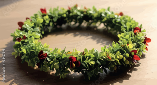 Hawaiian inspired green foliage lei with small red flowers rests on wood