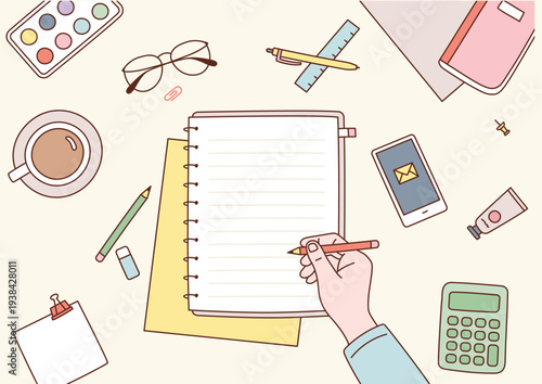 A person preparing to write or study with office supplies