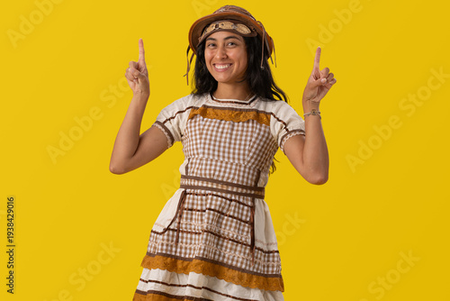Obraz na płótnie Brazilian woman wearing typical June festival costumes such as a dress and hat