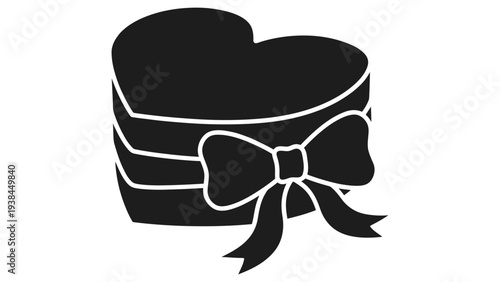 A black heart-shaped gift box with a bow on a white background