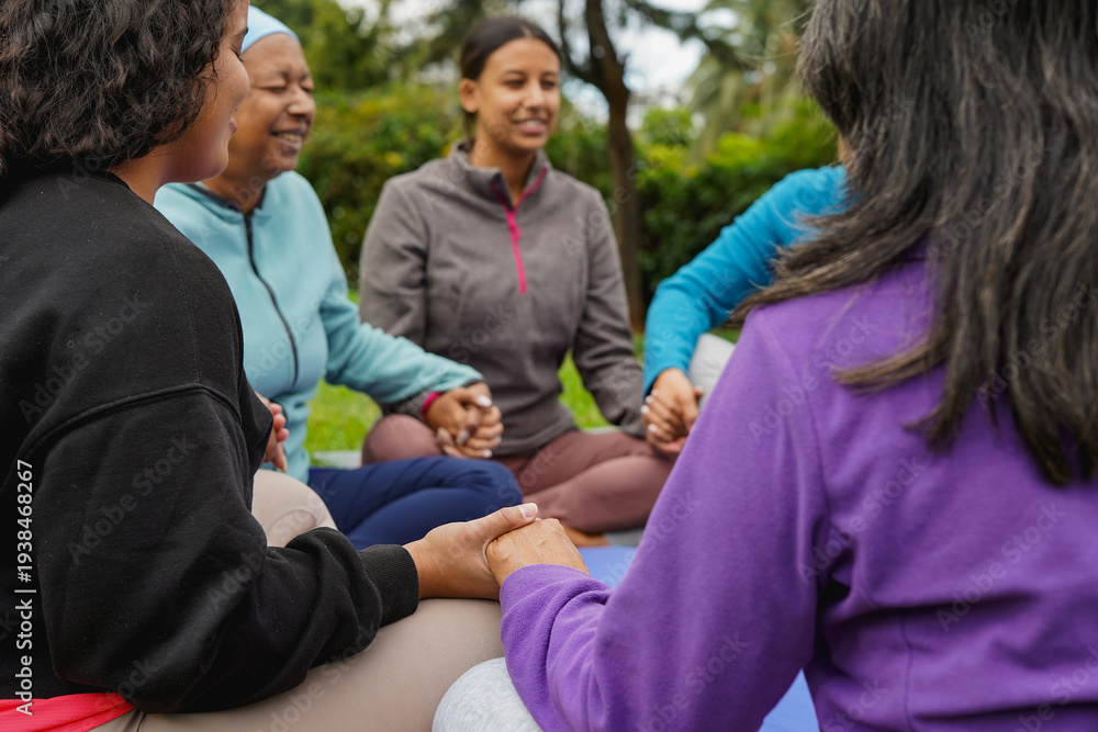Fototapeta premium Women circle doing healing meditation outdoor - Multi generational people with different body and ethnic - Mindfulness, connection and community concept - Focus on hands